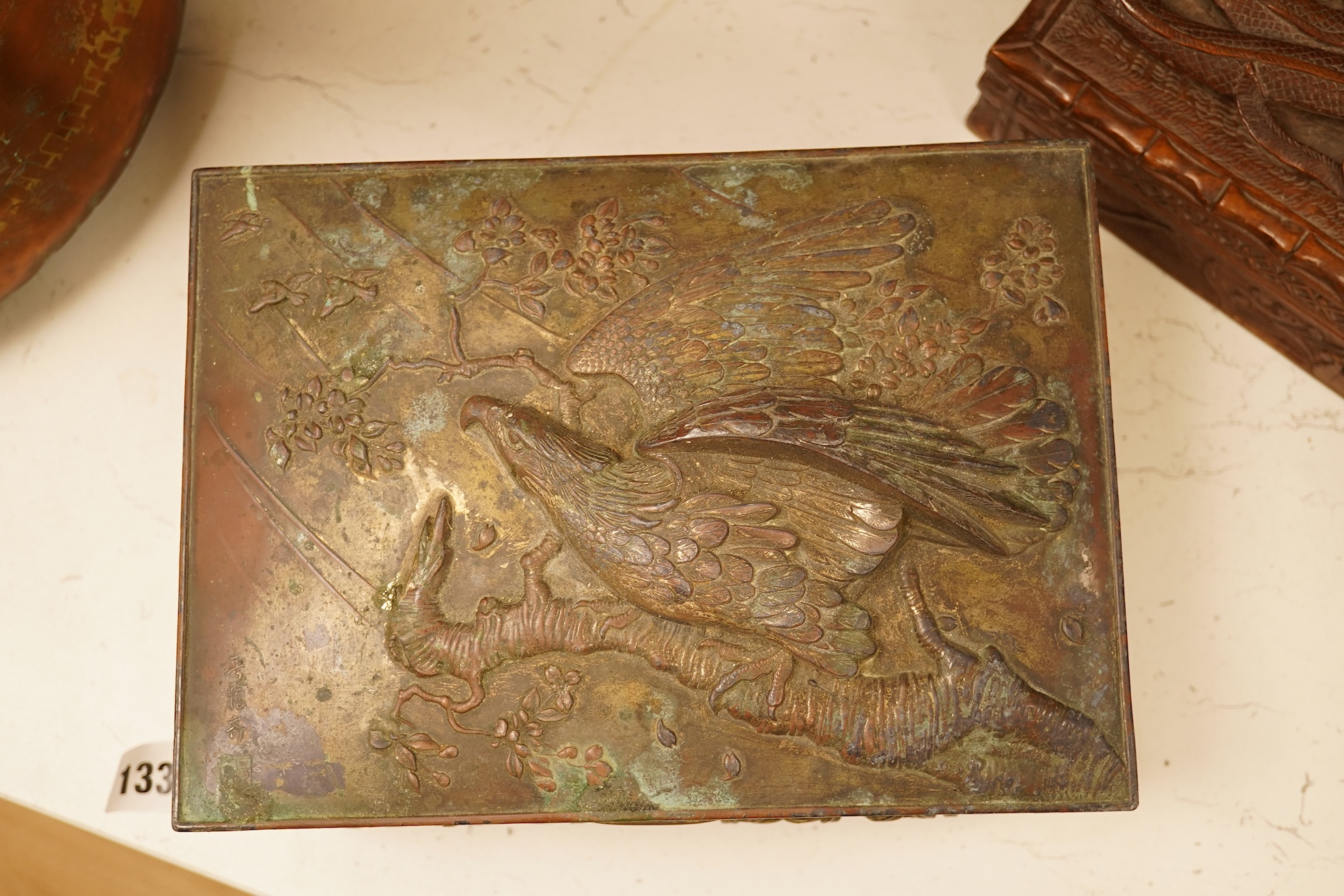 A late 19th century Japanese gilt metal lidded box together with a Burmese carved hardwood box, 28cm wide